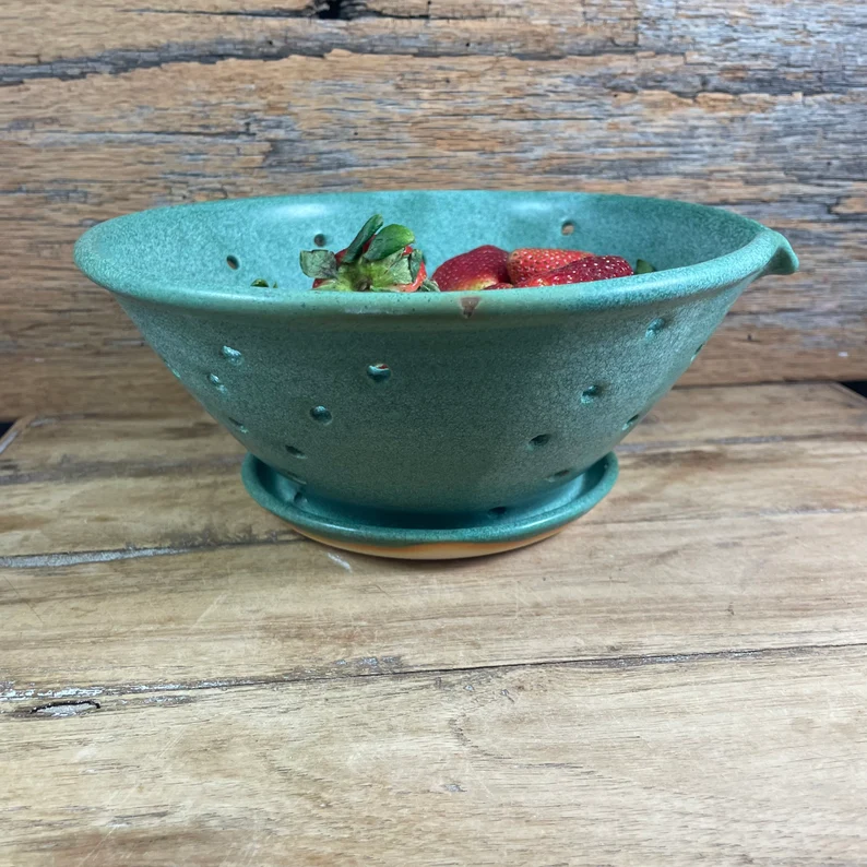 Copper green berry colander with strawberries