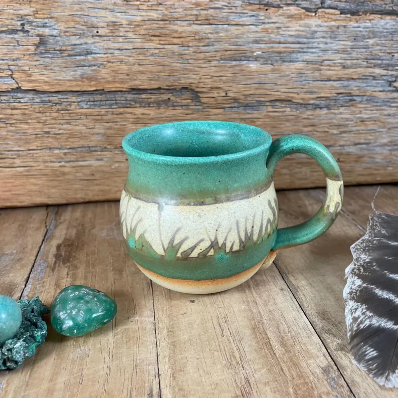 Copper green mug with carved grass texture